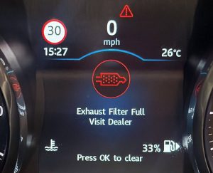 Dashboard displaying an Exhaust Filter Full warning on a diesel vehicle
